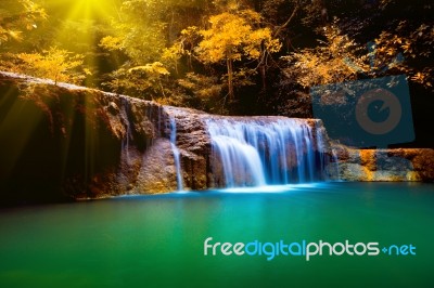 Erawan Waterfall In Thailand In Deep Forest With Sunbeam Stock Photo