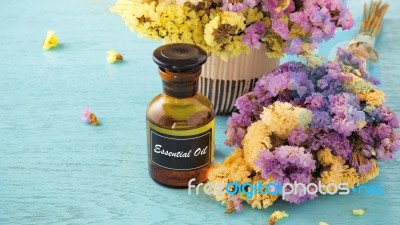 Essential Oil On Wood Background Stock Photo