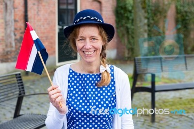 European Woman Celebrating Liberation With Dutch Flag Stock Photo