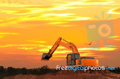 Excavator At Construction Site Stock Photo