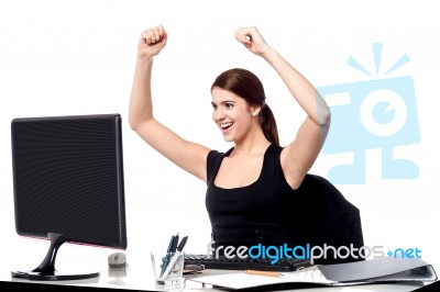 Excited Business Woman Raising Her Hands Stock Photo