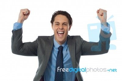 Excited Businessman Cheering Stock Photo