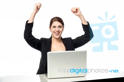 Excited Businesswoman Raising Her Arms Up Stock Photo