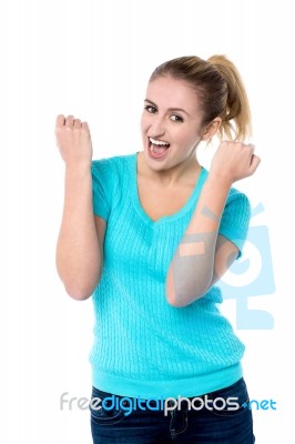 Excited Charming Girl With Clenched Fists Stock Photo