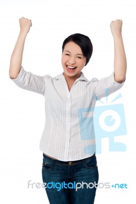 Excited Charming Girl With Clenched Fists Stock Photo