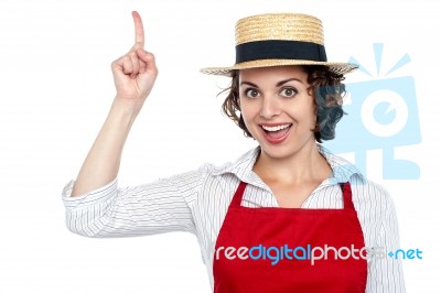 Excited Chef Woman Pointing Upwards Stock Photo