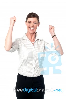 Excited Corporate Lady With Clenched Fists Stock Photo