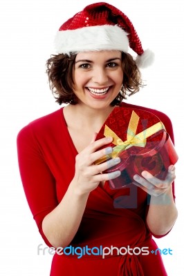 Excited Female Santa Opening Gift Box Stock Photo