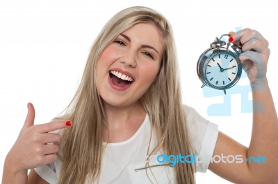 Excited Girl Holding Old Fashioned Alarm Clock Stock Photo