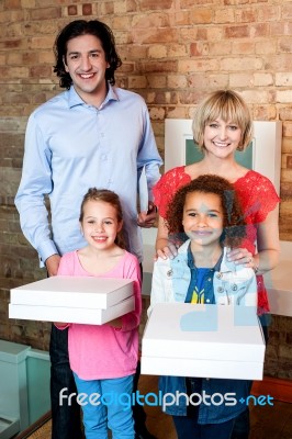 Excited Little Girls Holding Pizza Boxes Stock Photo