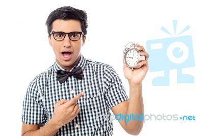 Excited Man Holding An Antique Clock Stock Photo