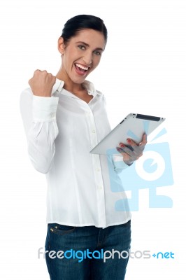 Excited Pretty Woman With Tablet Pc Stock Photo