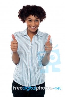 Excited Woman Gesturing Double Thumbs Up Stock Photo