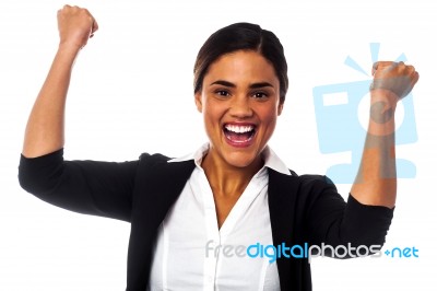 Excited Woman With Clenched Fists Stock Photo