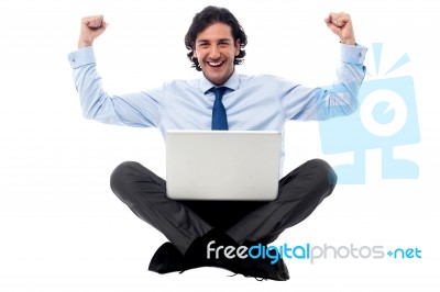 Excited Young Professional With Laptop Stock Photo