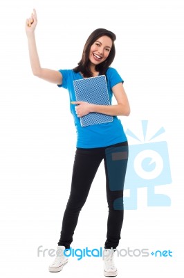 Excited Young Student Raising Her Hand Stock Photo