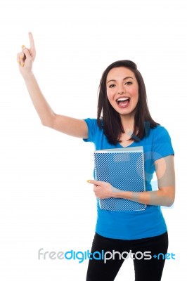 Excited Young Student Raising Her Hand Stock Photo