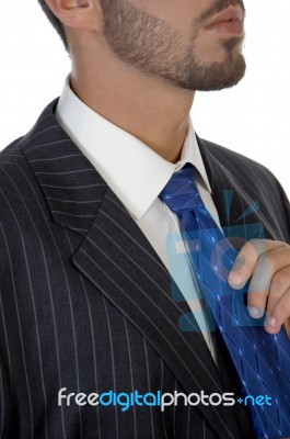 Executive Holding His Tie Stock Photo