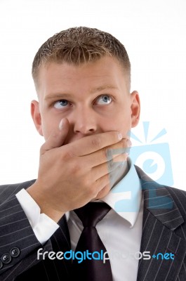 Executive With Hand Over Mouth Stock Photo