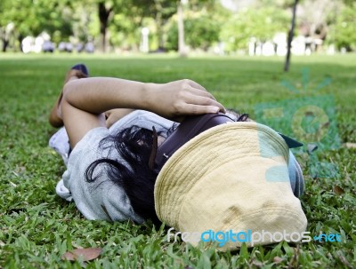 Exhausted Student Over The Grass Stock Photo