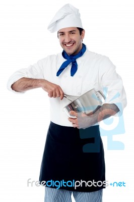 Experienced Male Chef Using Egg Beater Stock Photo