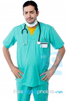 Experienced Surgeon With Hands On His Waist Stock Photo