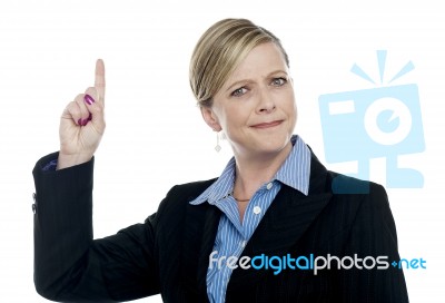 Expressive Businesswoman With Pointing Finger Stock Photo