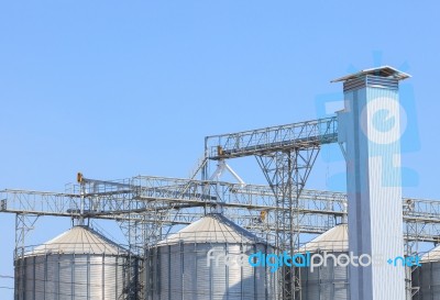 Exterior Structure Of New Agriculture Silo Building Against Blue… Stock Photo