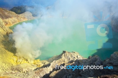 Extracting Sulphur Inside Kawah Ijen Crater, Indonesia Stock Photo