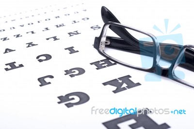 Eyeglasses Over Eye Chart Stock Photo