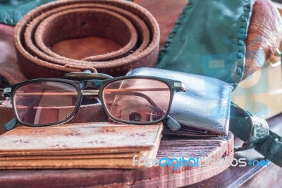 Eyewear And Leather  On A Table Stock Photo