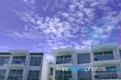 Facade Of Modern Low Rise Architecture In Blue Sky Stock Photo