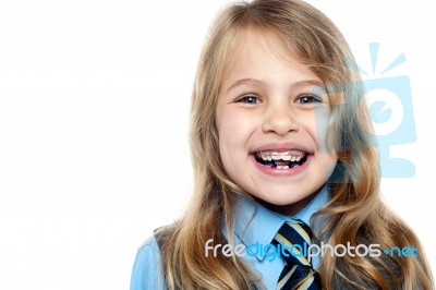 Face Closeup Of A Cheerful Young School Girl Stock Photo