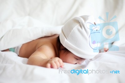 Face Down Lying Baby On Bed Stock Photo