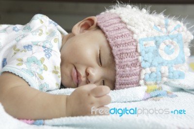 Face Of Baby Asleeping On Bed Stock Photo