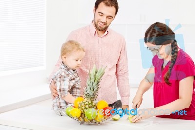 Family In Kitchen Stock Photo