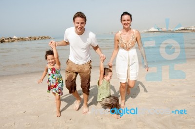 Family  In The Beach Stock Photo