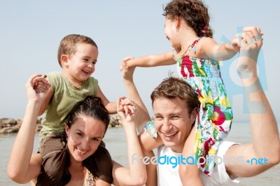 Family In The Beach Stock Photo