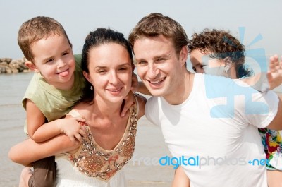 Family In The Beach Stock Photo