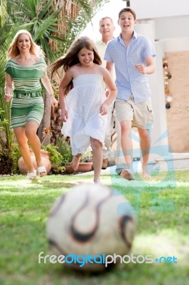 Family Members Playing Soccer Stock Photo