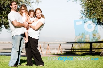 Family Posing For Picture Stock Photo