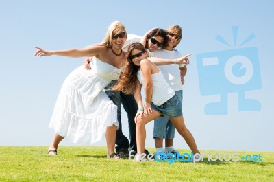  Family Relaxing In Garden Stock Photo