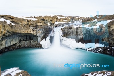 Fantastic Waterfall Hidden Among Mountains Stock Photo