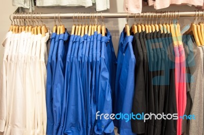 Fashion Clothing On Hangers Stock Photo