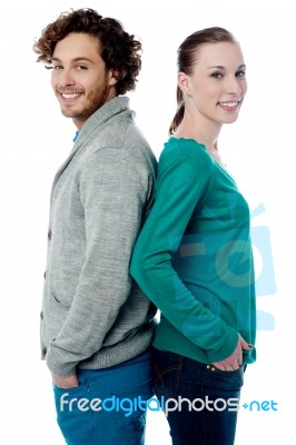 Fashion Couple Posing Back To Back Stock Photo