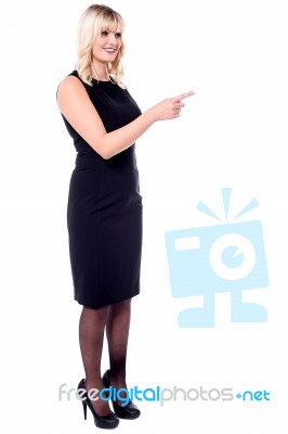 Fashion Lady Pointing Out Something Stock Photo