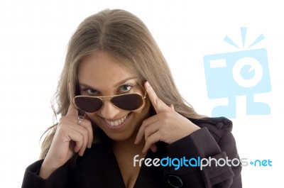 Fashion Woman Peeping Over Sunglasses Stock Photo