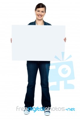 Fashionable Trendy Woman Holding Blank Ad Board Stock Photo