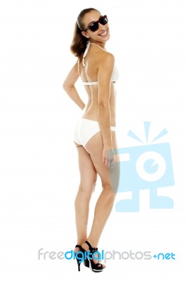 Fashionable Woman In White Two-piece And Shades Stock Photo