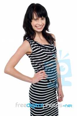 Fashionable Young Girl In Trendy Sleeveless Attire Stock Photo